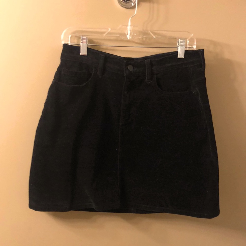 Black corduroy mini skirt. Size Medium